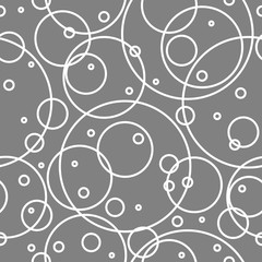 Seamless abstract pattern with white empty overlapping circles of different size.