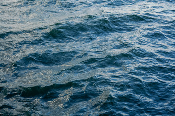 Waves on transparent water surface