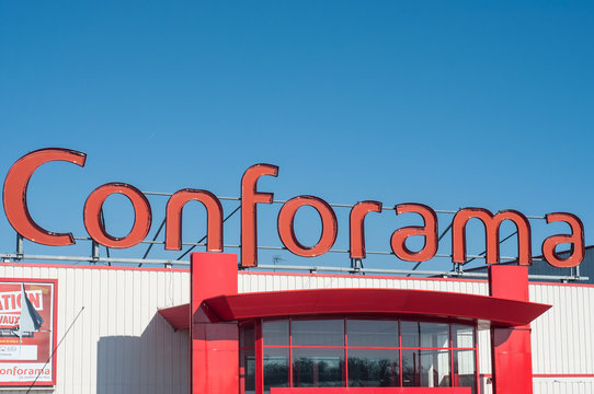 Conforama logo on store front on blue sky background - Conforama is the french leader of the furnishing chain in France