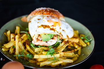 home made chicken burger with fried egg & french fries