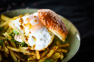 home made chicken burger with fried egg & french fries