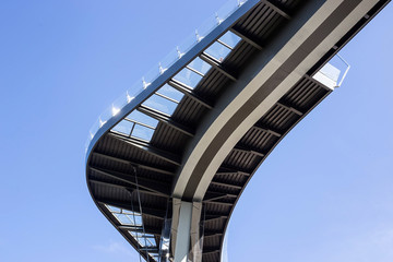 Obraz premium Modern urban architecture bridge curved against the sky