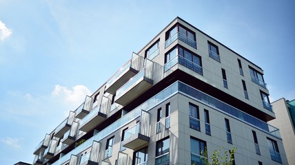 Obraz premium Multistory new modern apartment building. Stylish living block of flats.