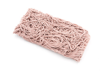 Chinese traditional staple food not yet cooked on a square dry purple noodle, on a white background