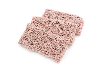Three stacked rectangular dry Purple noodles are the staple food in China on a white background.