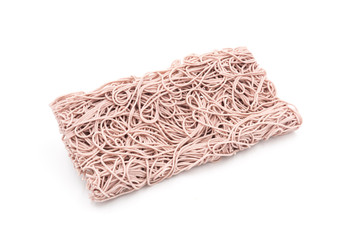 Chinese traditional staple food not yet cooked on a square dry purple noodle, on a white background