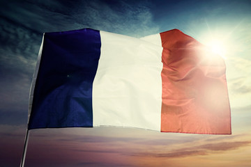 France flag blowing at dawning time