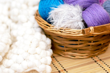 Colorful yarn for knitting in a basket. Crafts, Hand-made.