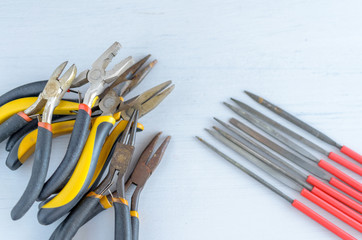 Metal jewelry making tools on the table. Creative craft concept