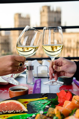 couple of girls in love celebrate with glasses of wine