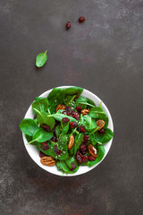 Salad with pecan nuts and dry cranberries