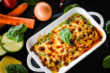 spinach lasagna with fresh vegetables
