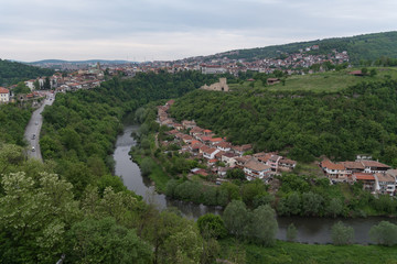Fototapeta na wymiar Panoramic view of Veliko Tarnovo old town, Yantra river and View to tower and Trapezitsa fortress. Bulgaria