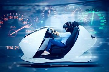 Unknown woman playing a virtual racing game