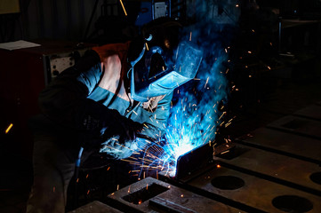 Welder at work in a workshop for the manufacture of metal structures.