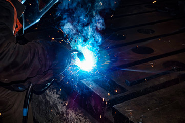 The welder makes metal structures from metal products and connects them with a weld.