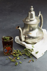 Traditional Moroccan Mint Tea with silver teapot, arabic drink