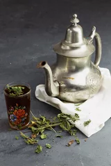 Foto op Aluminium Traditional Moroccan Mint Tea with silver teapot, arabic drink © hadjanebia