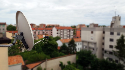 TV antenna on the roof of the house. A photograph of an antenna that is used to receive satellite...
