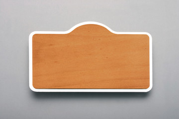 Metal or wooden name plate for insertion into collar or shirt pocket. Metal or wooden name tag.