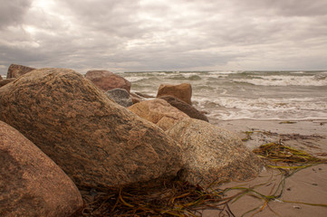 rocks on beach at sunset