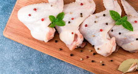 chicken wings on the kitchen board