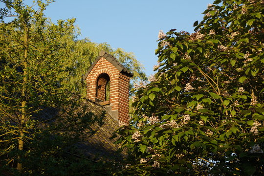 a bell tower of a historical monastery in drachten