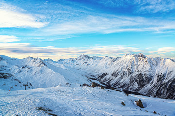 Fototapeta na wymiar Panorama of the Alpine mountains in the evening at the ski resort of Ischgl, Austria