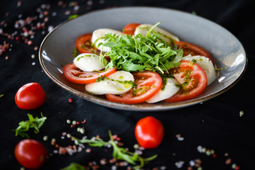 italian caprese salad with fresh mozzarella, tomatoes & basil