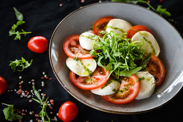 italian caprese salad with fresh mozzarella, tomatoes & basil