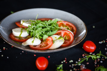 italian caprese salad with fresh mozzarella, tomatoes & basil