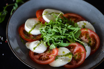 italian caprese salad with fresh mozzarella, tomatoes & basil