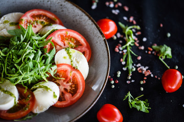 italian caprese salad with fresh mozzarella, tomatoes & basil