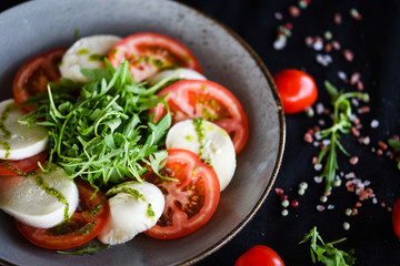 italian caprese salad with fresh mozzarella, tomatoes & basil