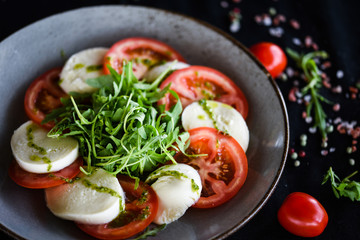 italian caprese salad with fresh mozzarella, tomatoes & basil
