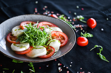 italian caprese salad with fresh mozzarella, tomatoes & basil