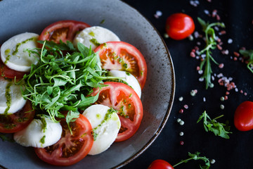 italian caprese salad with fresh mozzarella, tomatoes & basil