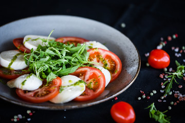 italian caprese salad with fresh mozzarella, tomatoes & basil