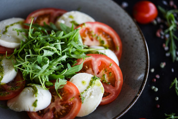 italian caprese salad with fresh mozzarella, tomatoes & basil