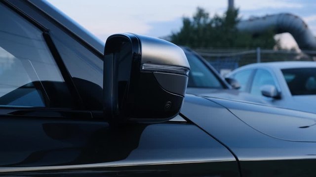 Side rear-view mirror on a modern car.