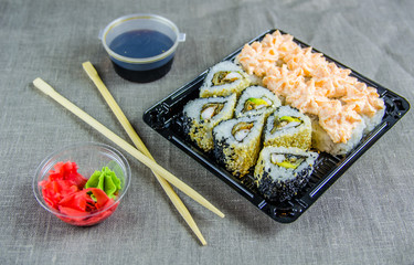 delivery of rolls at home. Sticks, soy sauce.