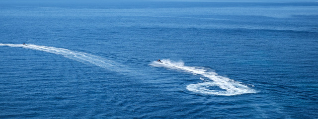 People are playing a jet ski in the sea