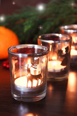 decorative christmas candles in a candlestick on a new year background