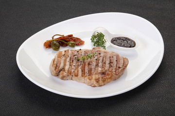 Grilled pork steak with pepper sauce