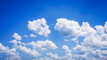 Naklejka na ściany i meble Wide photo of fluffy clouds in deep-blue sky