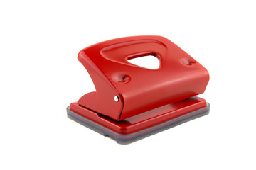 Red office paper hole puncher, isolated on white background