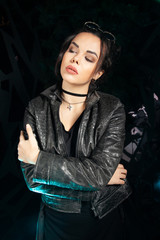 Beautiful goth fashion stylish girl on black studio background