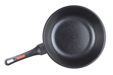 Black frying pan with nonstick surface isolated on white background, closeup, top view.