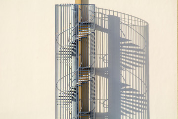 Circular metal stair with abstract shadows