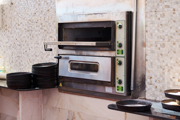 pizza oven in the restaurant kitchen, close up
